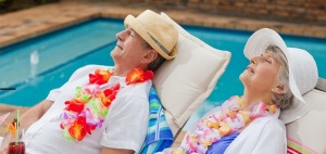 Retired couple sleeping beside the swimming pool